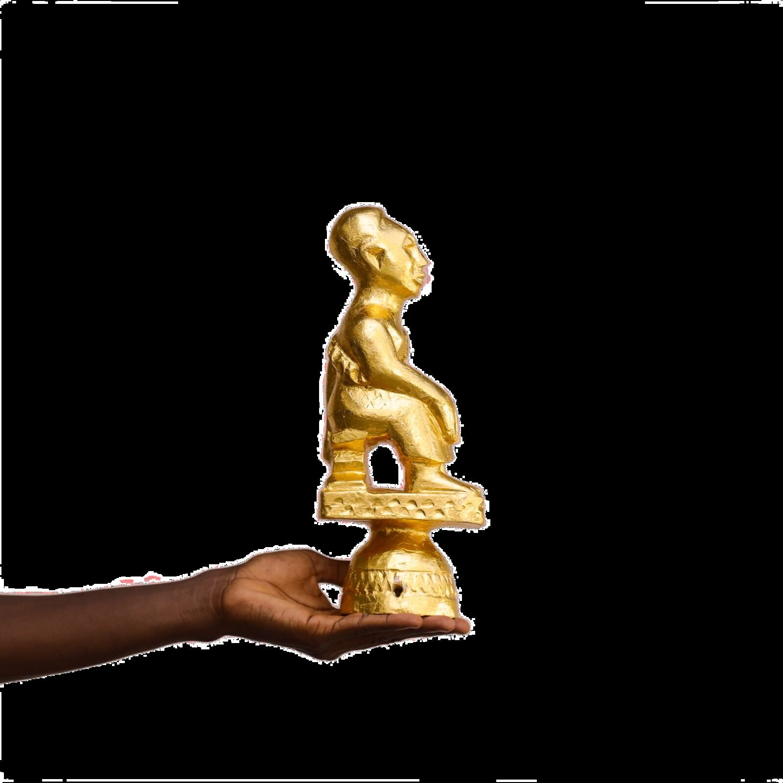 Gold finial held for documentation